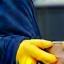 Fleetlink courier handling packages securely, hands with gloves